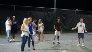 Pam and Kelsey participating in "tennis pong". One of the Friday night events kicking off the tournament.